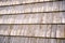 Close-up texture of wooden planks lined in rows, wooden roof on a house.