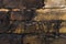 Close-up Textured background of old faded bricks stained with black oil. A brick gradient between dirty black and light