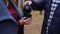 Close-up of a thermos in hands, a girl drinks a drink.