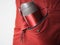 Close up of thermos mug in side pocket of jacket