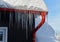 close up of thick blue ice and many icicles