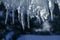 close up of thick blue ice and many icicles