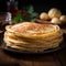 Close up of thin pancakes stacked on a rustic wooden plate