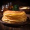 Close up of thin pancakes stacked on a rustic wooden plate