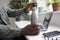 Close Up Of Thirsty Man In Office Opening Reusable Water Bottle For Drink