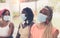 Close-up of three African American girls wearing surgical masks