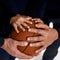 Close up of three generations of men hands on ball