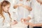 Close up at three generations of women doing manicure together