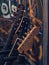 Close up of three guitar head stocks, guitars in studio on stands