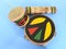 Close-up of three handmade Brazilian percussion instruments: small drum with drumstick, pandeiro tambourine and ganzÃƒÂ¡, a type o