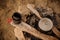 Close-up of three pans on a campfire