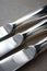 Close up of three silver knives