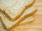 Close up three slice whole wheat bread on wooden table