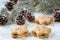 Close up of three traditional bulgarian star shaped, double honey cookies Medenki, with jam filling and colorful sugar sprinkles