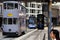 Close up of three trams pulling into stop on Hong Kong Island,