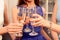 Close up of three women clinking with glasses of shampagne