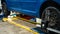 Close-up of a tire clamped by a leveler that passes the automatic alignment of the wheels in the garage, garage and