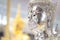 Close up to the Asia antique brightness and glitter Buddha statue inside Thailand Temple