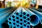 Close up to blue plastic pipe background, PVC pipes stacked in warehouse
