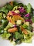 Close up to an ease to do avocado and orange salad with greens