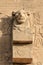 Close up to a lion sculpture in the wall of Temple of Hathor at Dendera, Luxor (Egypt)