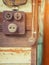 Close up to a very old light electric retro switch on on a wooden board. Vintage switch,