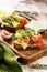 Close-up toast with salted fish, cheese, eggs, onion rings and salad. Appetizing canapes or sandwiches with smoked salmon