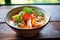 close-up of tom yum goong with vibrant tomato pieces