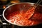 close-up of tomato sauce simmering in a pan