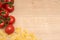 Close-up of tomatoes and fusilli pasta with copyspace