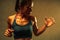 Close up of the top part of muscle lean healthy body of 40 year old asian woman in fitness training tops show the muscle and sweat