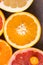 Close up top view of beautiful variety of fresh citrus fruits half cut. Oranges, lemons , clementine, red grapefruit.