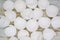 Close up top view of lots of broken white eggshells on an aged wood background