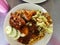 Close up or top view Malaysia famous cuisine. Nasi Kandar or Kandar Rice