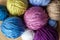 Close-up top view of multicolored woolen balls.