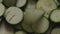 Close-up, Top View, Ringed Zucchini Zucchini Fall to the Bottom of a Metal Bowl