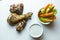 Close up top view shot of isolated grilled barbecue chicken wings and legs, a bowl of fresh orange carrots and juicy green celery