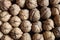 Close-up top view of whole walnuts in shells, highlighting natural beauty, and texture.