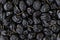 Close-up topview photo of dried dark grapes as a background