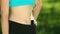 Close-up of torso of athletic fitness woman. Slim girl with athletic body.