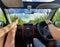 CLOSE UP Tourist couple in a red jeep drives across a large sugarcane plantation