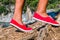 Close up of a tourist girl feet wearing red shoes hiking on cefalonia island, mediterranean, greece