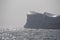 Close up of towering wall of textured massive iceberg