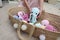 Close-up toy octopus in the hands of a young girl. In the frame is a large knitted toy octopus in the hands of an