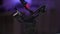 Close-up tracking shot of assembled steadicam on blurred background with bokeh lights. Stages of assembling and