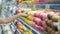 Close up, trading shelf with fruits, vegetables, buyer takes lemon from counter