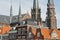 Close-up on traditional facades on the main square Markt with the spires of Maria van Jesse Kerk