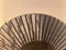 close up of a traditional fan affixed to the wall