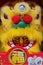Close-up of a traditional lion dance toy, sold at a Chinese New Year bazaar, with the word `Fu` Wealth