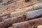 Close up of traditional orange clay Portugal roof tiles  on a castle in Silves